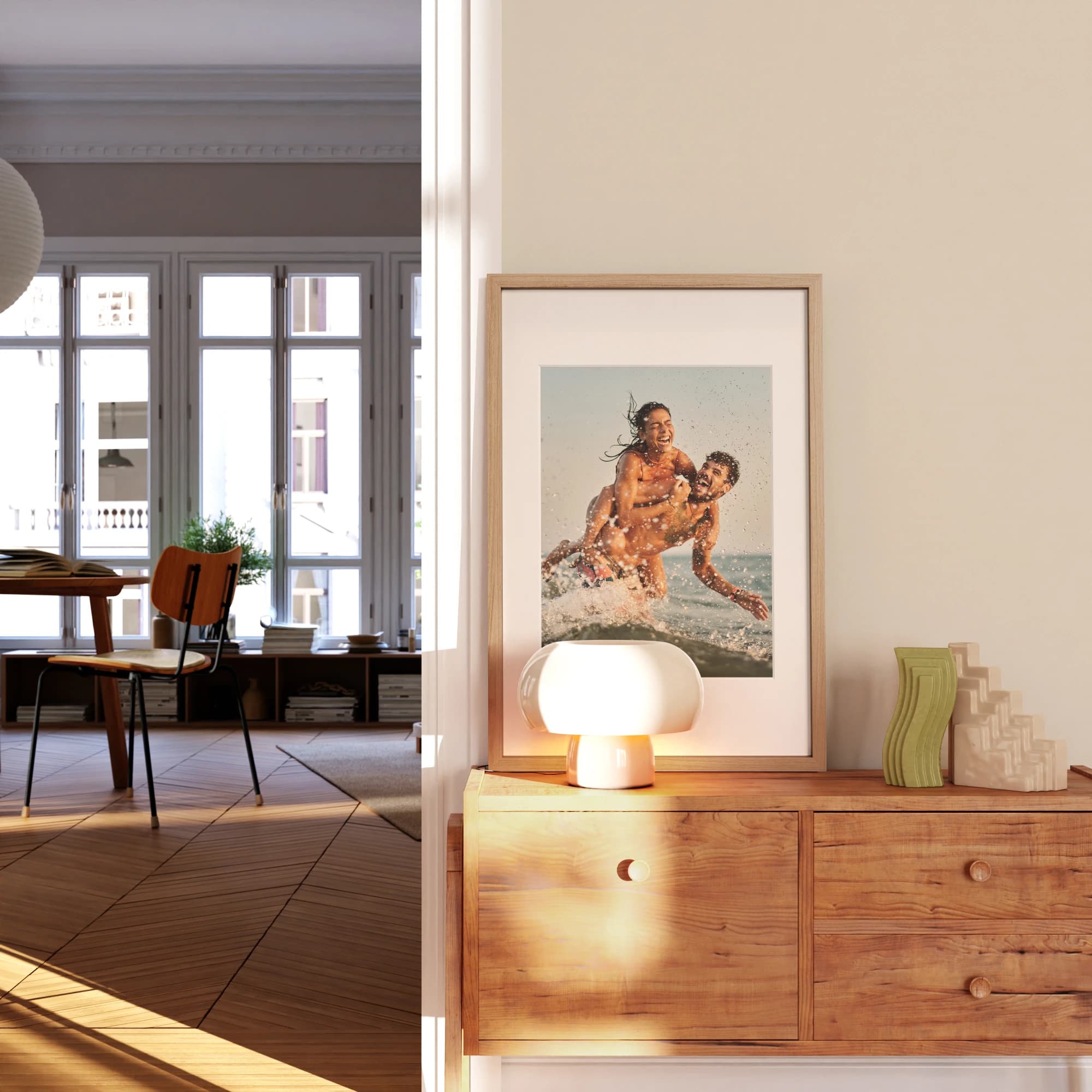 A framed beach photograph displayed on a wooden cabinet