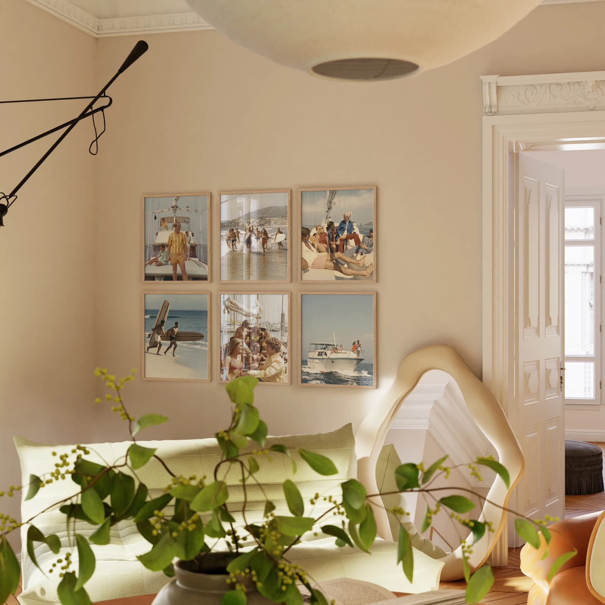 Six matching oak frames displaying photographs above a sofa